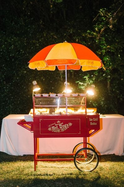 Vintage hot dog cart with umbrella and lights